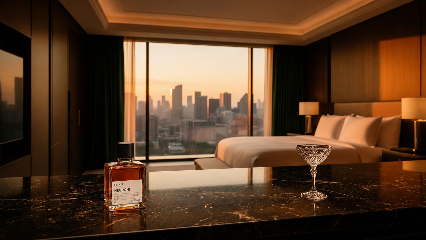 A square cocktail bottle on a dark marble bar in a luxury suite at dusk